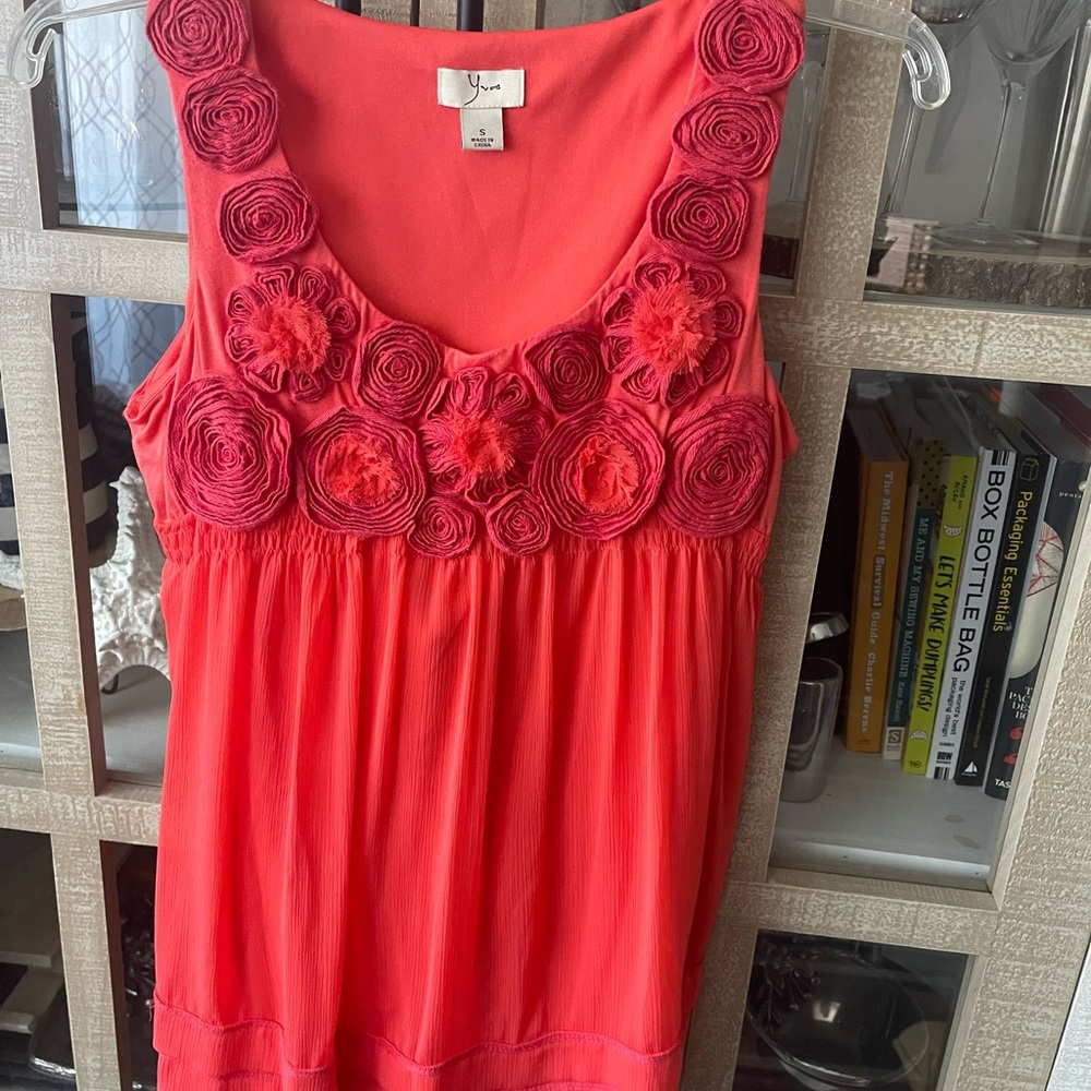 Vibrant Coral Sleeveless Blouse with Rosette Details